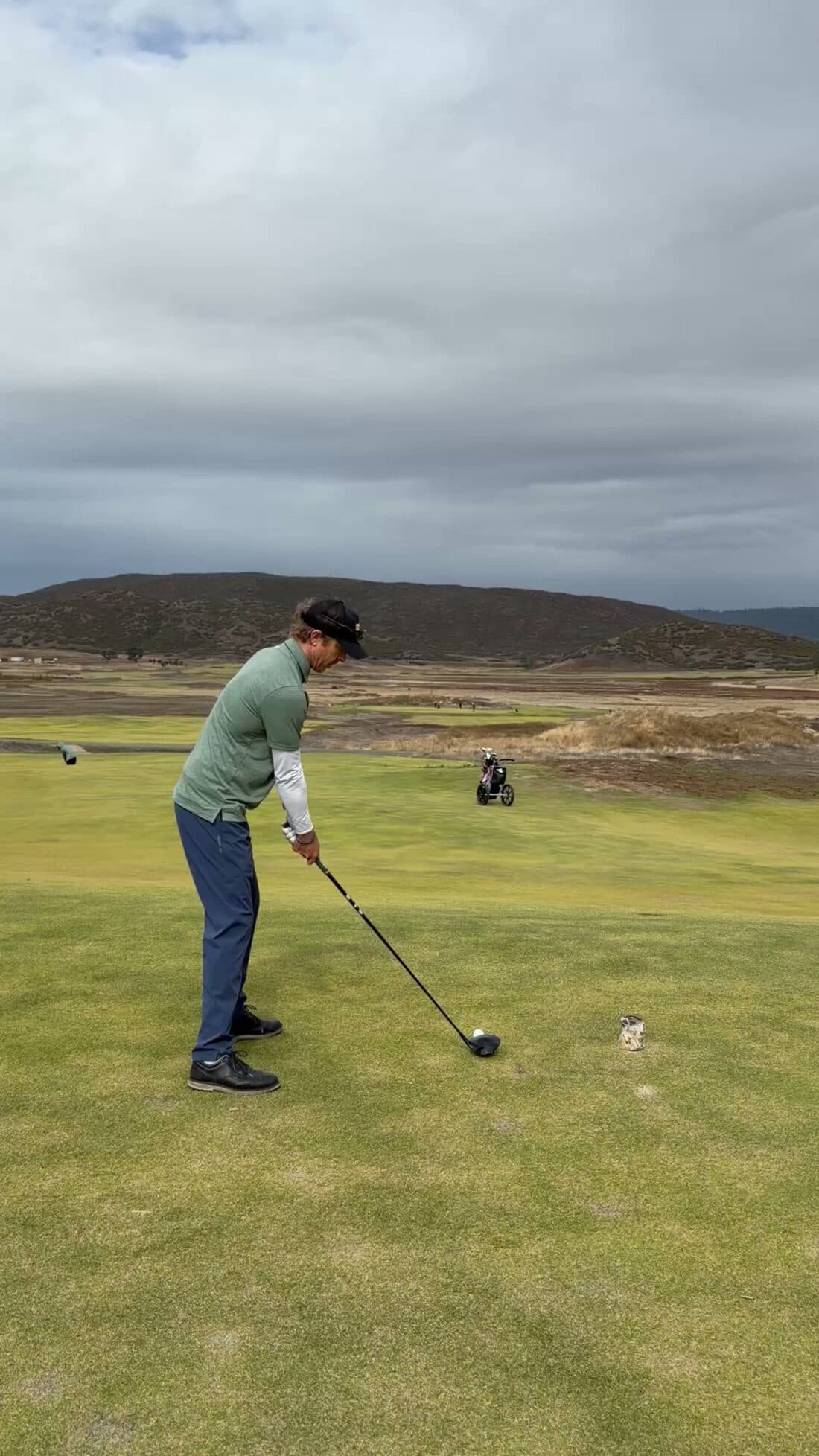 Michael Farley setting up to a tee shot during a private golf lesson in San Francisco.